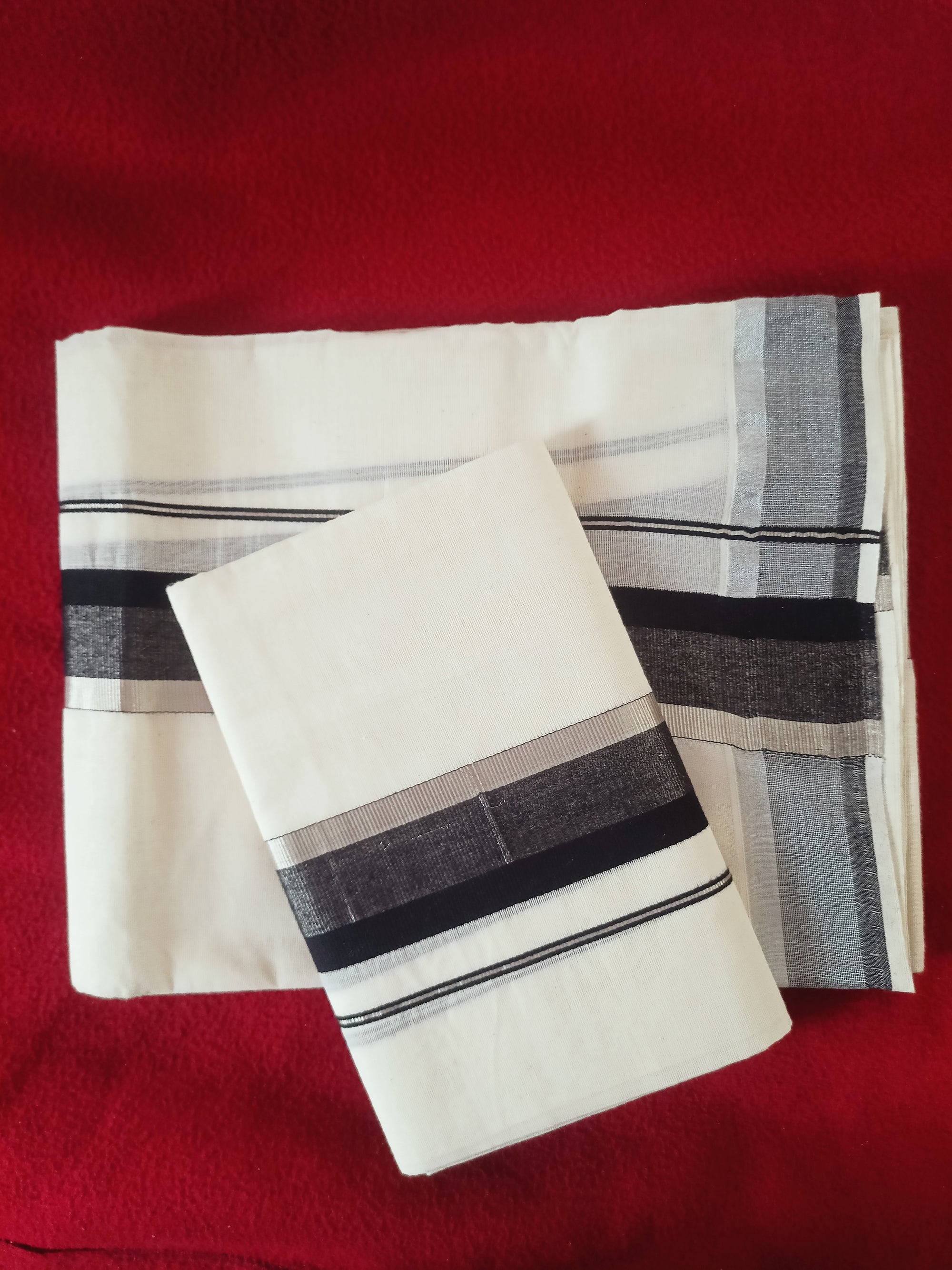silver and black set mundu